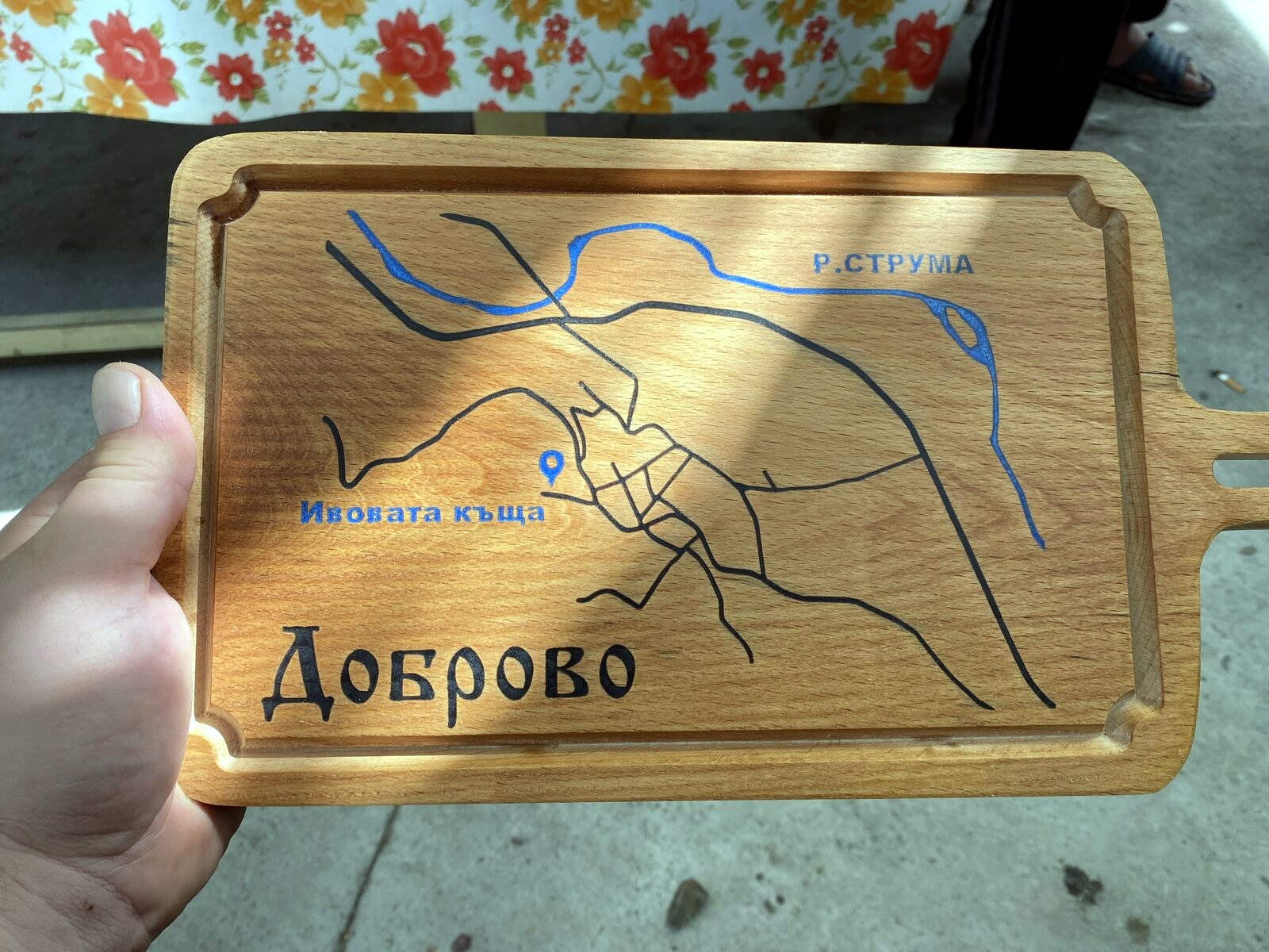 Wooden map sign of Dobrovo village with engraved details