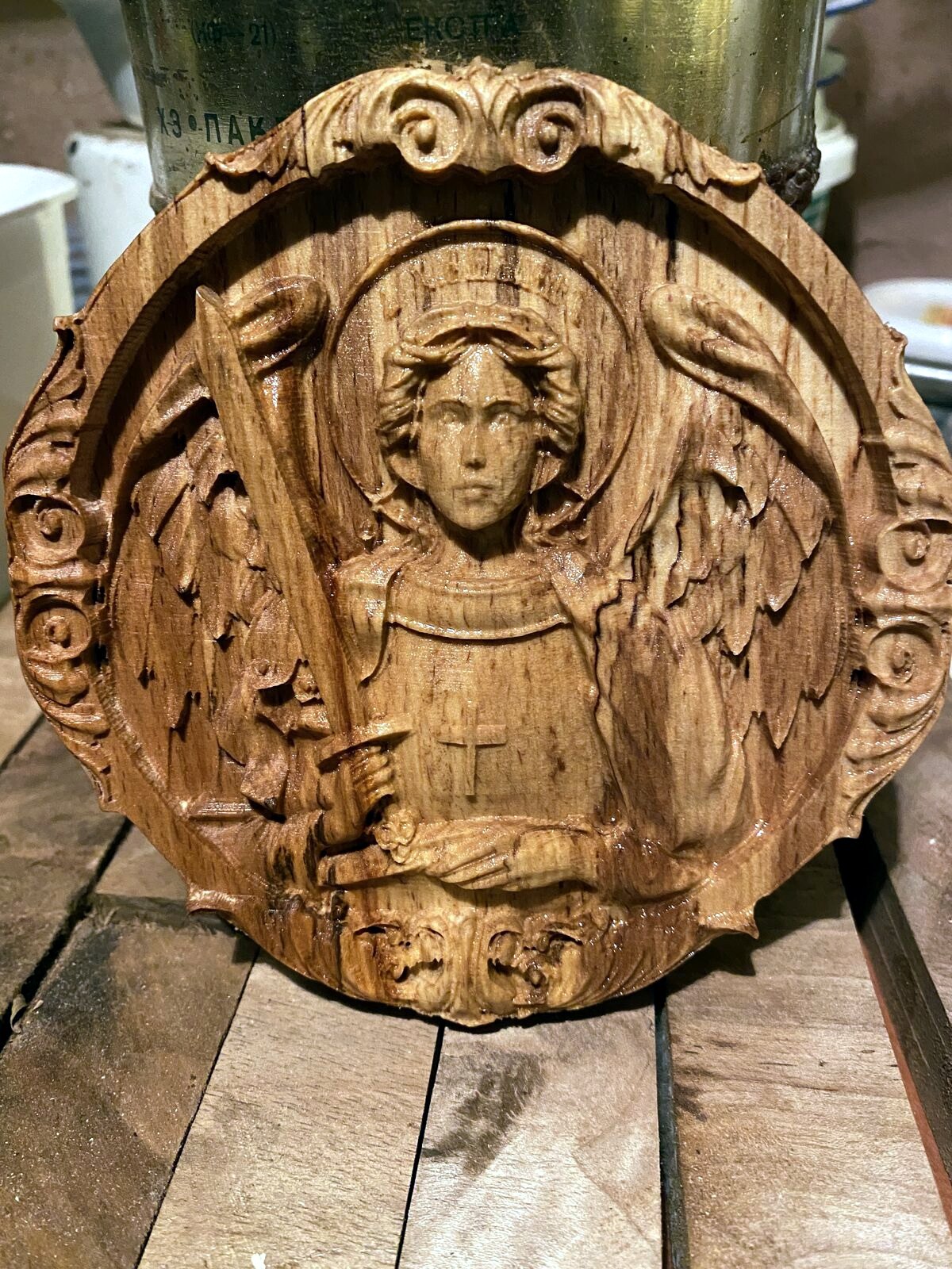 Finished circular wood rosette relief panel