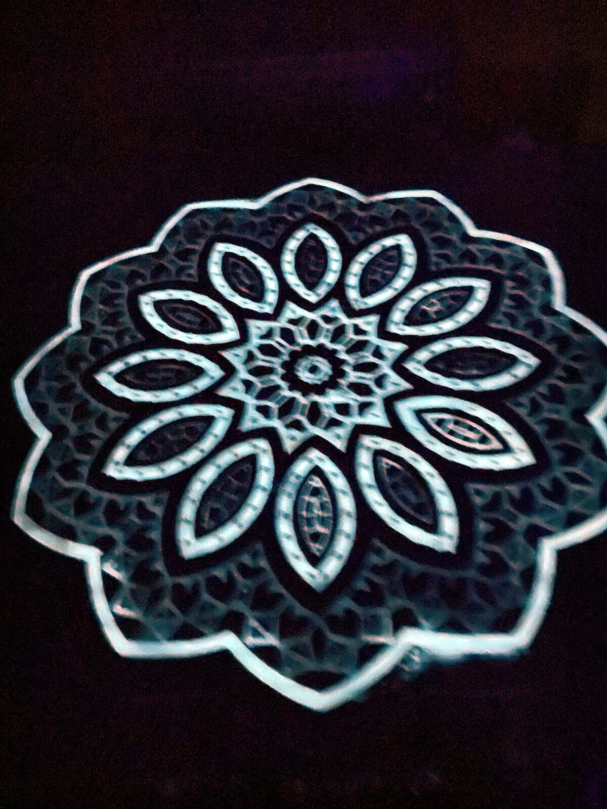 Backlit wooden mandala night light casting warm patterns