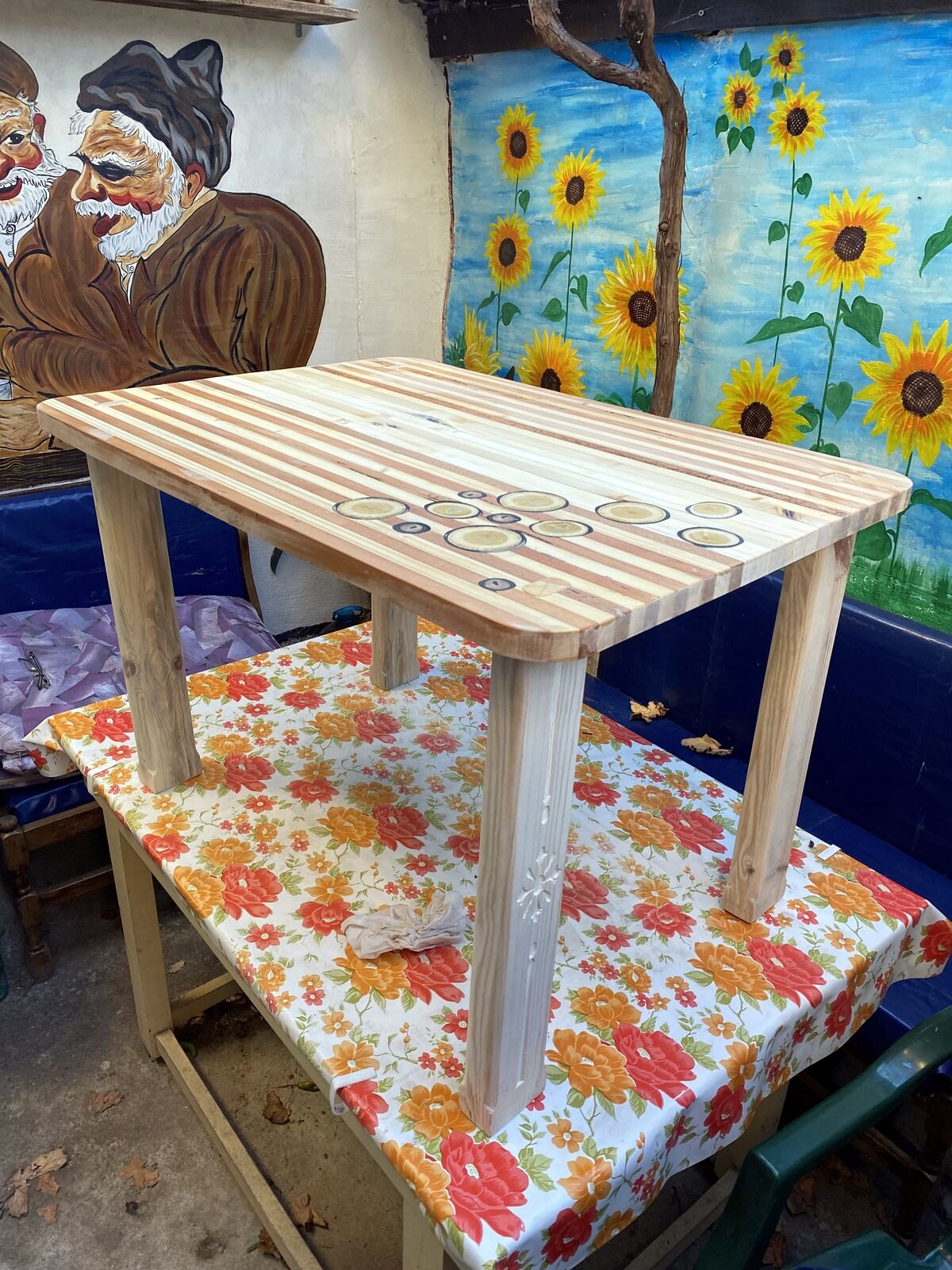 Small wooden side table with intricate mandala engraving