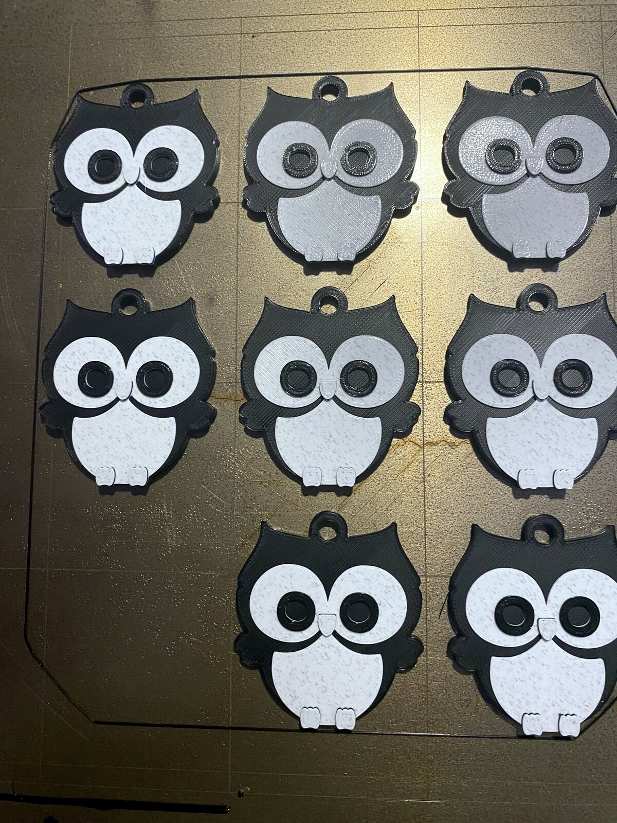 Multiple colorful 3D printed owl models