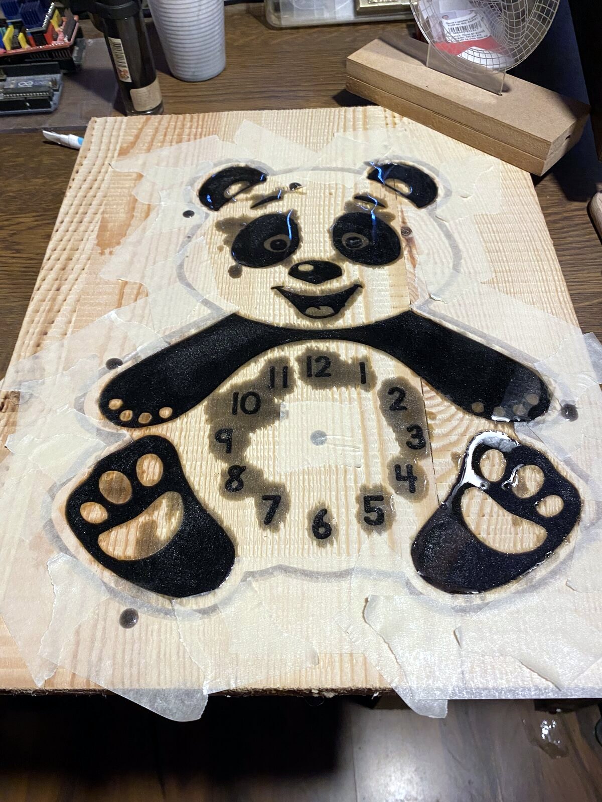 Laser cut panda clock wooden pieces before assembly